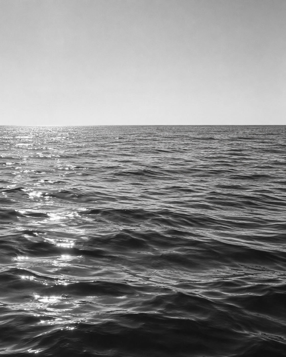 AI-created black-and-white study of calm open Mediterranean water